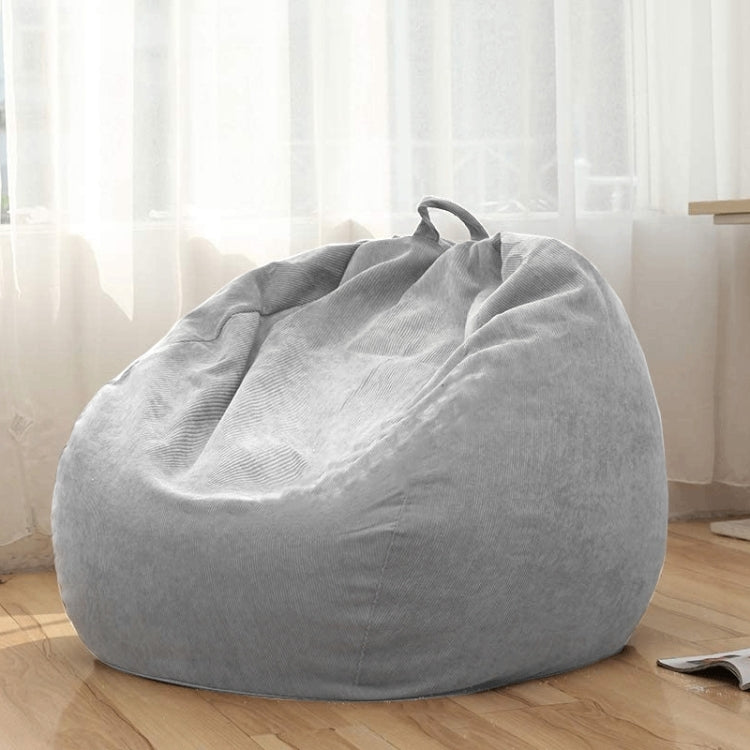 Light grey corduroy bean bag chair cover on floor with top handle