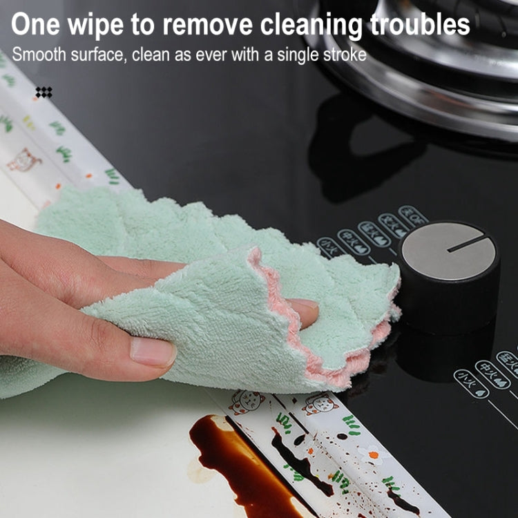 Kitchen border sticker strip with colorful icons along a countertop while wiping clean