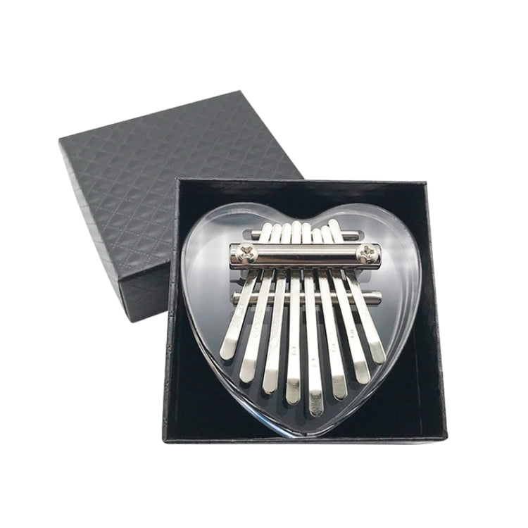 Mini 8-tone kalimba with clear heart soundboard and metal tines, in black case