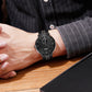 SKMEI men’s quartz wristwatch on wrist with black dial and black mesh strap