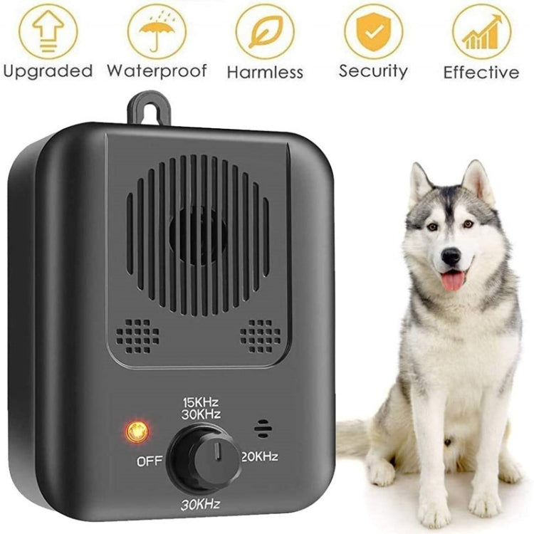 Black ultrasonic bark control device front view with settings dial and red indicator light