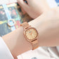 Women’s quartz watch with rose gold mesh bracelet and cream dial on wrist