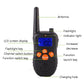 Black handheld remote with LCD screen, antenna, buttons, and built-in flashlight