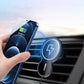 Black magnetic wireless car charger holder holding a smartphone near the air vent