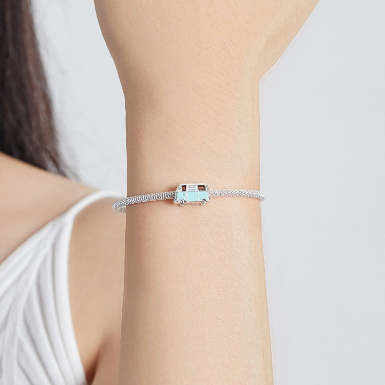 Mini bus charm bead bracelet on wrist with mint and pale yellow enamel and silver chain