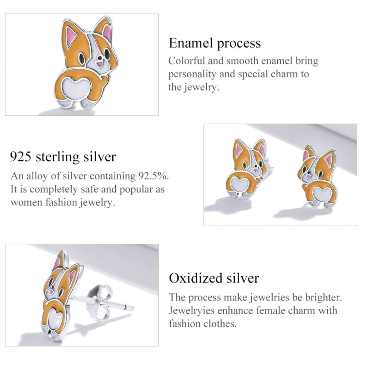 Corgi ear stud earrings in sterling silver with orange enamel and butterfly-style detail