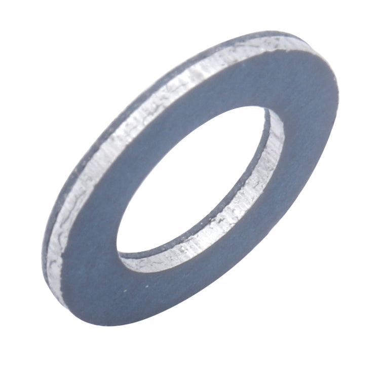 Oil drain plug washer gasket, angled view of blue round washer with central hole