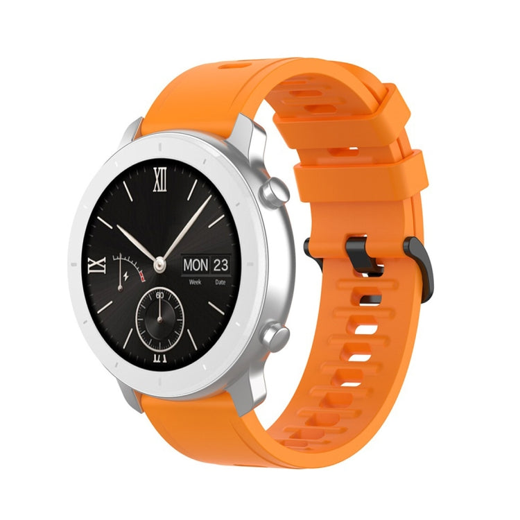 Orange silicone smartwatch replacement strap with adjustable buckle and perforation holes