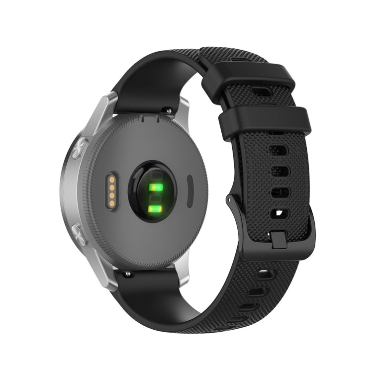 Black silicone smartwatch replacement strap with textured perforations and quick-release buckle