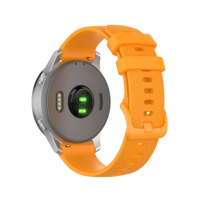 Orange silicone smartwatch replacement strap with textured perforations and quick-release buckle