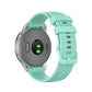 Silicone smartwatch replacement strap in mint green, textured band with metal clasp and holes
