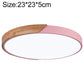 Round LED ceiling lamp with wood accent and pink outer ring
