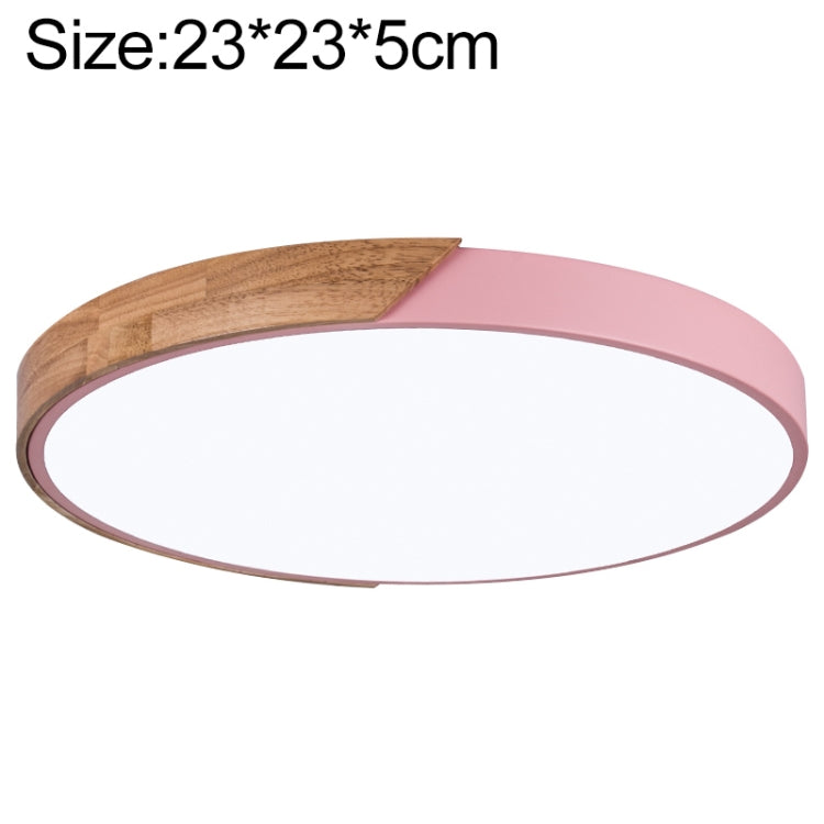 Round LED ceiling lamp with wood accent and pink outer ring