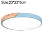 Round LED ceiling lamp with wood accent and light blue outer ring