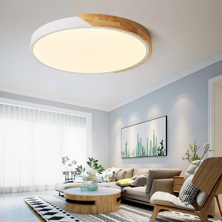 Round white LED ceiling lamp with light wood rim, flush-mount style.