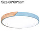 Round LED ceiling lamp with wood trim, 60 cm, light blue outer ring and white diffuser.