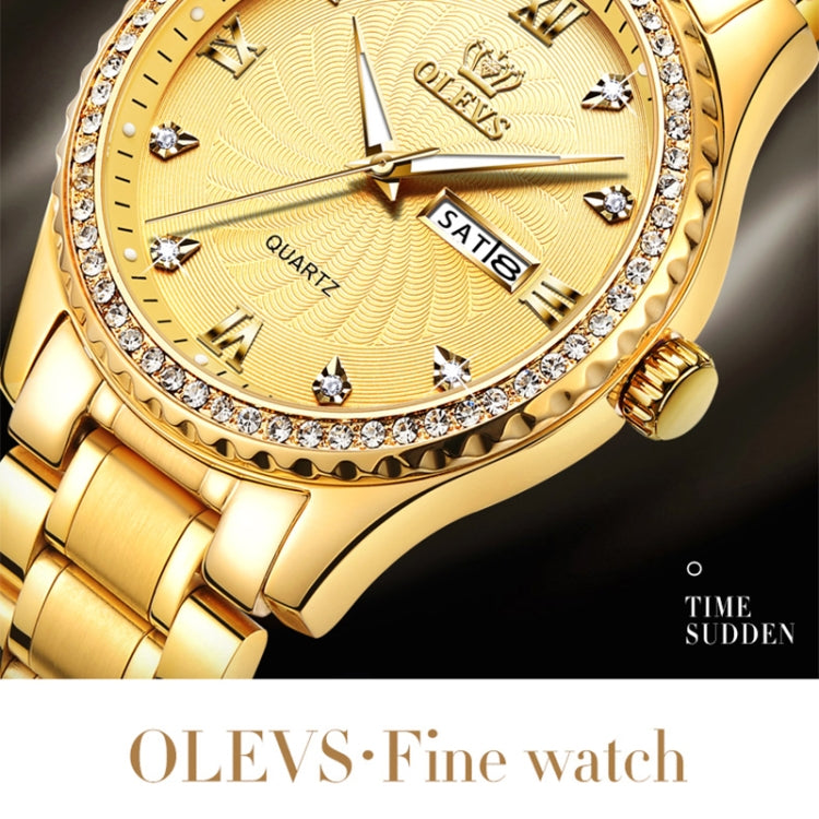 Close-up of gold-tone quartz watch dial with crystal markers and rhinestone bezel
