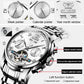 Close-up of OLEVS watch dial showing open-heart movement and calendar details