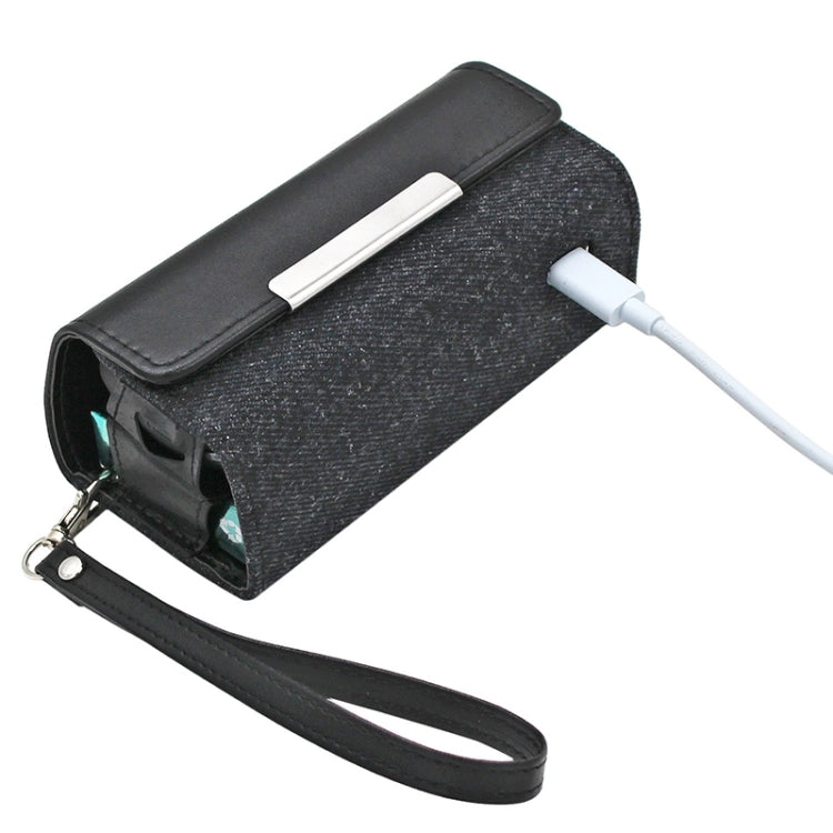 Black two-tone leather storage pouch with keyring, front slot, and wrist strap