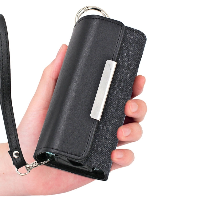 Black leather e-cigarette storage pouch held in hand with keyring and front slot