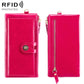 Pink leather wallet with snap strap and gold zipper; front view.