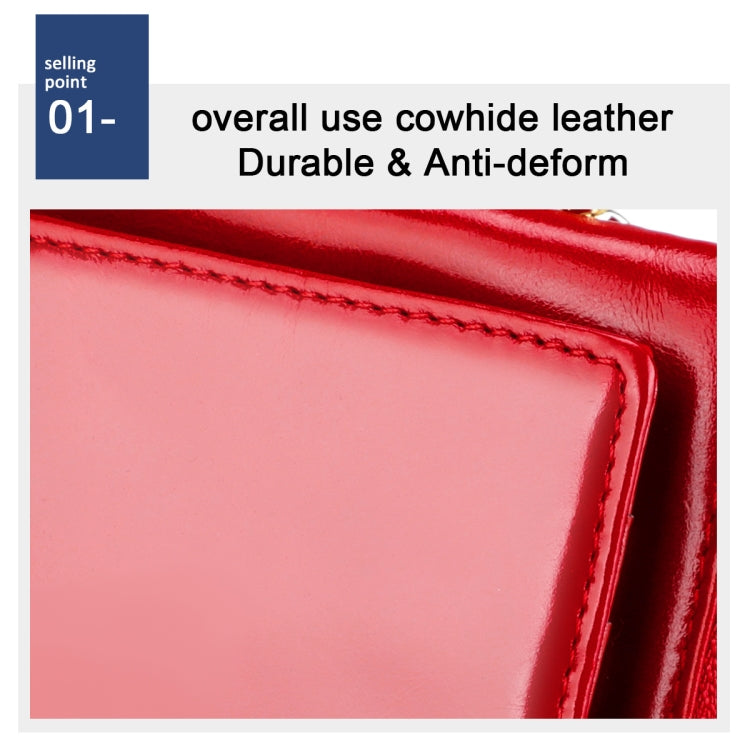 Red leather wallet edge close-up with decorative stitching and glossy finish.