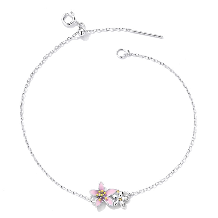 Sterling silver adjustable chain bracelet with pink cherry blossom flower charm