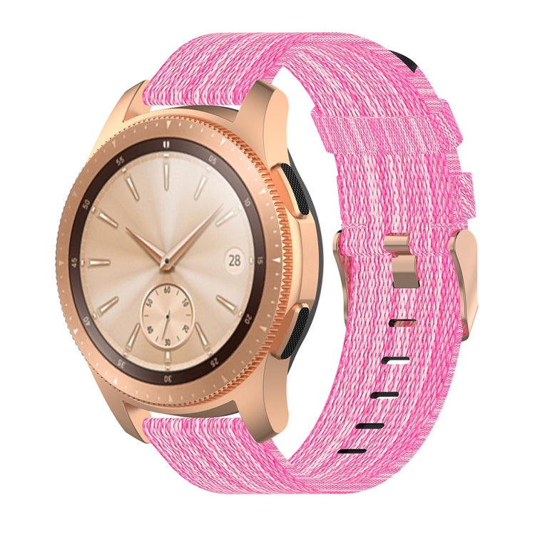 Pink nylon canvas watch strap with rose-gold smartwatch case and dial