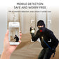 White dome security camera on stand beside a smartphone app screen