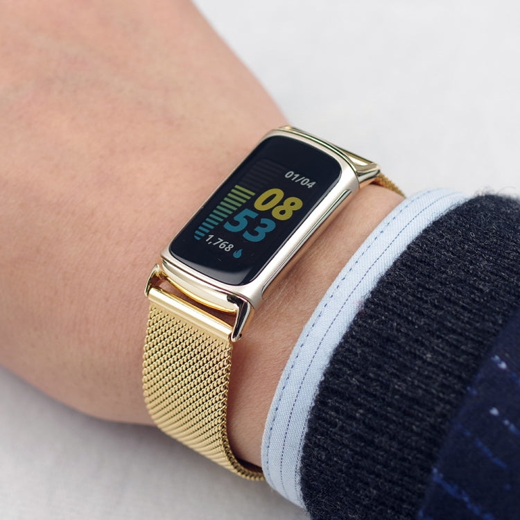 Gold magnetic metal mesh watch band on wrist, rectangular smartwatch with dark display