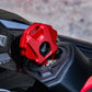 Red motorcycle key shell mounted on the bike with a textured grip