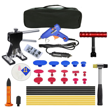 Paintless dent puller kit with glue gun, tabs set, handles, and black storage bag