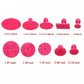 Set of pink suction pulling tabs with measured sizes for dent repair