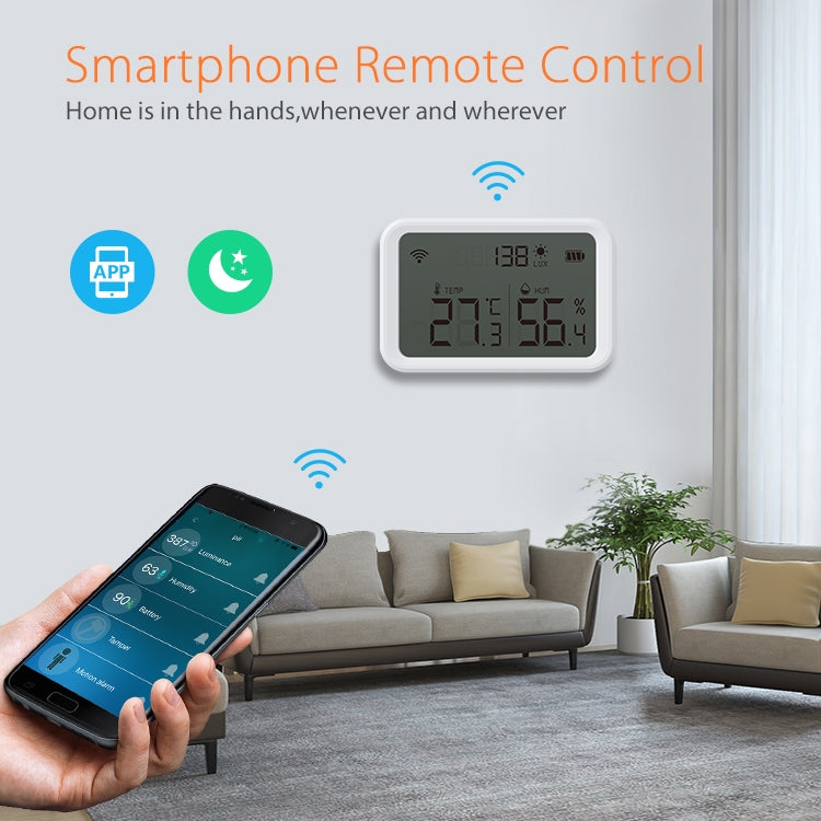Wall-mounted smart temperature and humidity sensor with LCD displaying indoor readings.