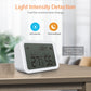 White light-detection temperature humidity sensor on a wooden surface with LCD readings.