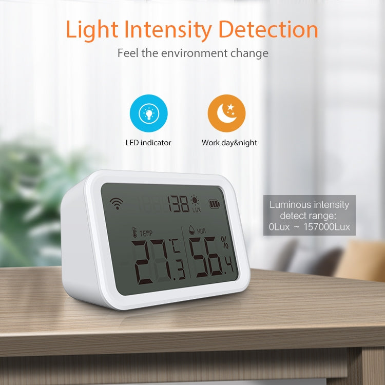 White light-detection temperature humidity sensor on a wooden surface with LCD readings.