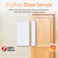 Zigbee door sensor kit mounted on a wall: white sensor pad and slim magnet bar.
