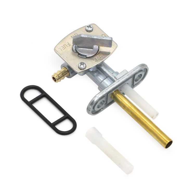 Motorcycle fuel petcock valve kit with silver body, gold tube, white seal and black gasket