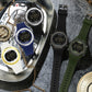 Assorted digital luminous watches with round cases and silicone straps, close-up view
