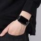 Black PU strap LED electronic watch on wrist with dark square face and side buttons