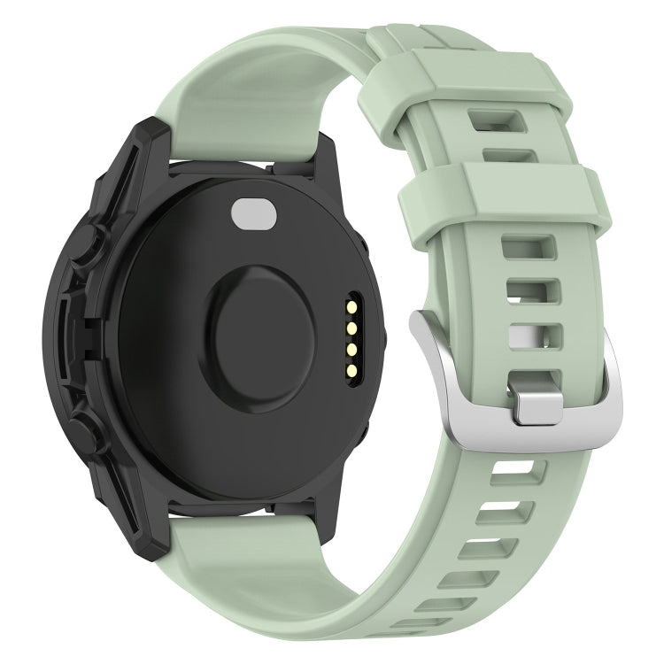 22mm silicone watch band in light green with secure buckle and perforated holes.