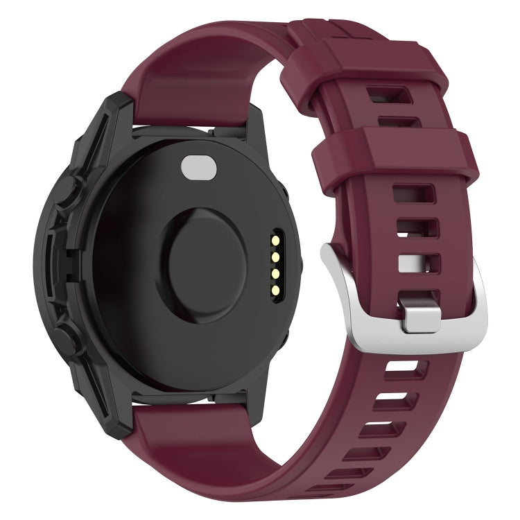 22mm silicone watch band in wine red with buckle and perforated strap holes.