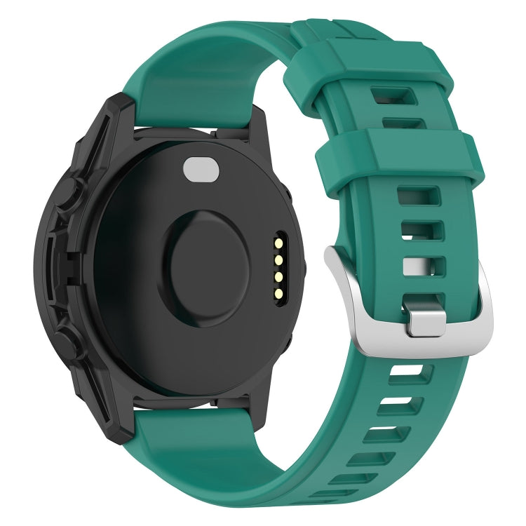 22mm silicone watch band in teal green with buckle and perforated strap holes.