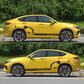 Yellow car side with evil rabbit decal on black racing stripes reading RACINGSPEED