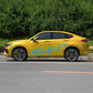 Yellow car side with blue dragon totem decal across the doors.
