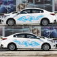 White car side with blue dragon totem decal across the doors.