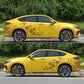 Car door and fender flower decals on a yellow SUV, small daisy pattern