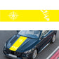 Yellow compass pattern decorative sticker with white compass rose and jagged graphic on car hood.