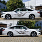 Black animal-flame vinyl decal on white performance car side, two angles