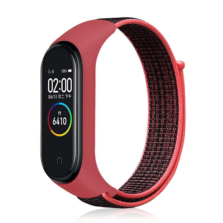 Nylon weave watch band with red-pink strap for fitness tracker, red display case.